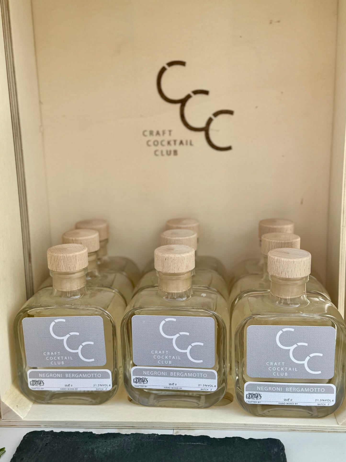 picture of 9 bottles of negroni bianco in a wooden box