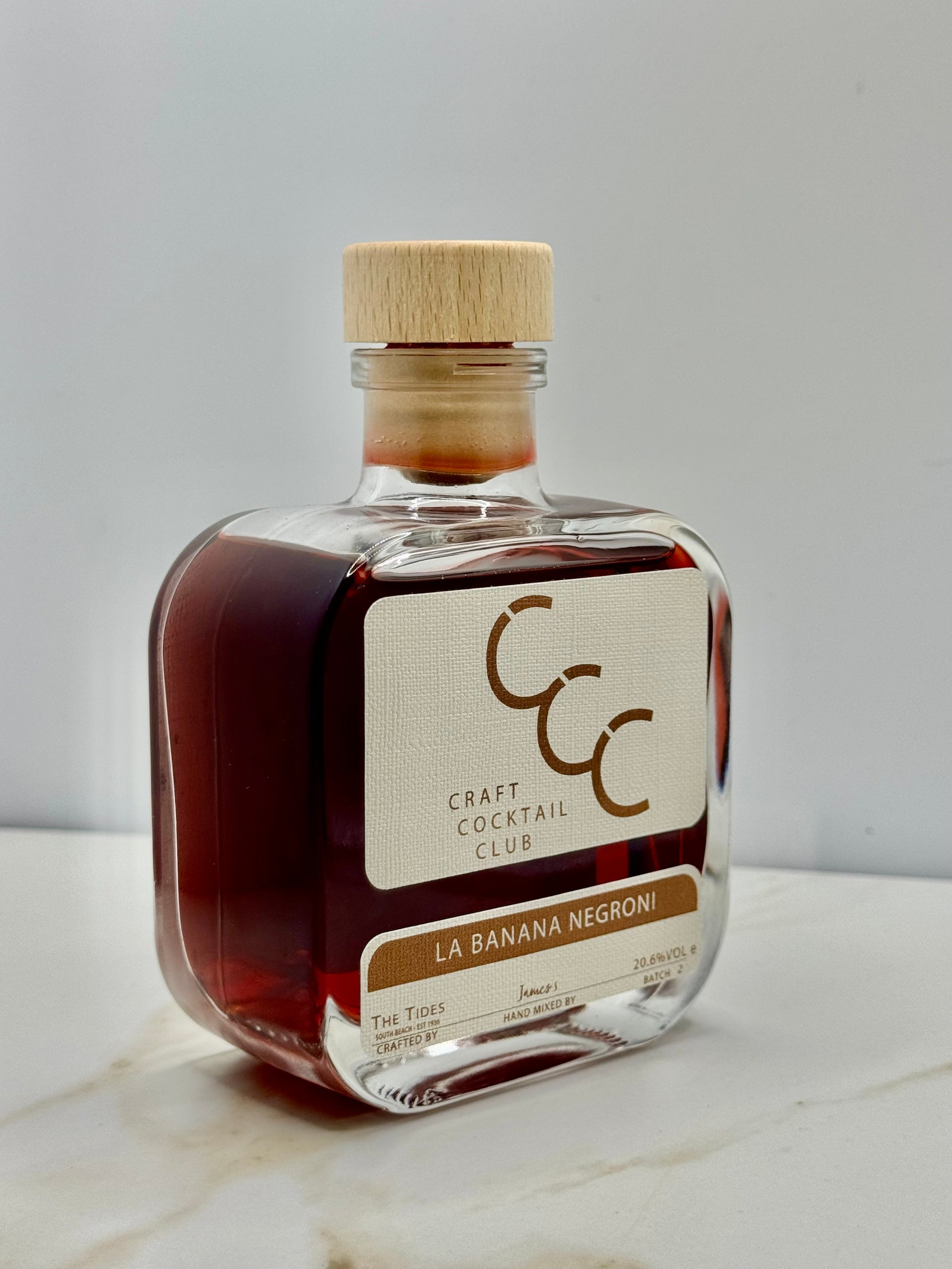 Picture of a single bottle of Banana Negroni on  White tile 