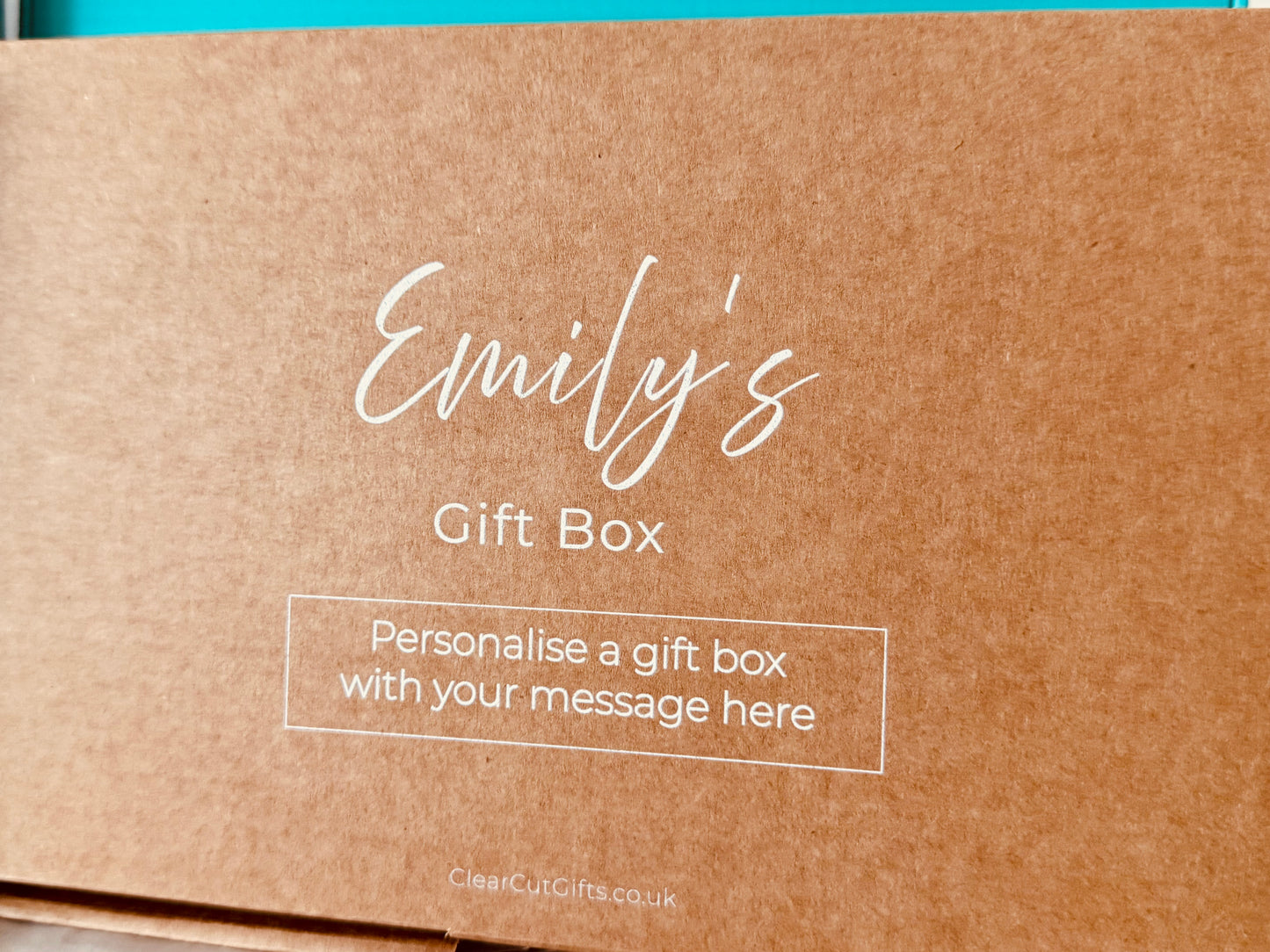 Brown gift box with 'Emily's Gift Box' text and a personal message printed on the box in white
