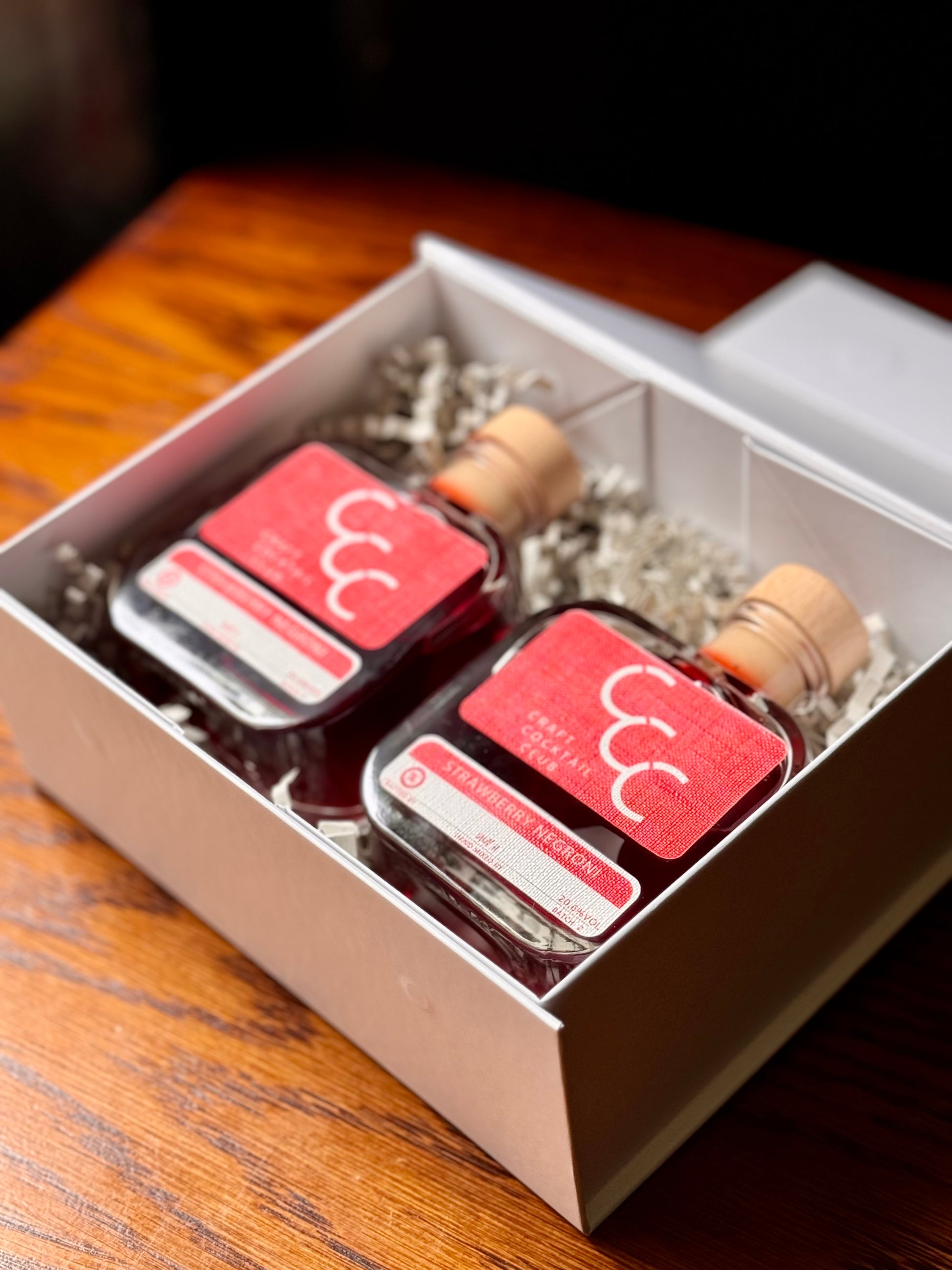 picture of a negroni gift set  on a wood table 