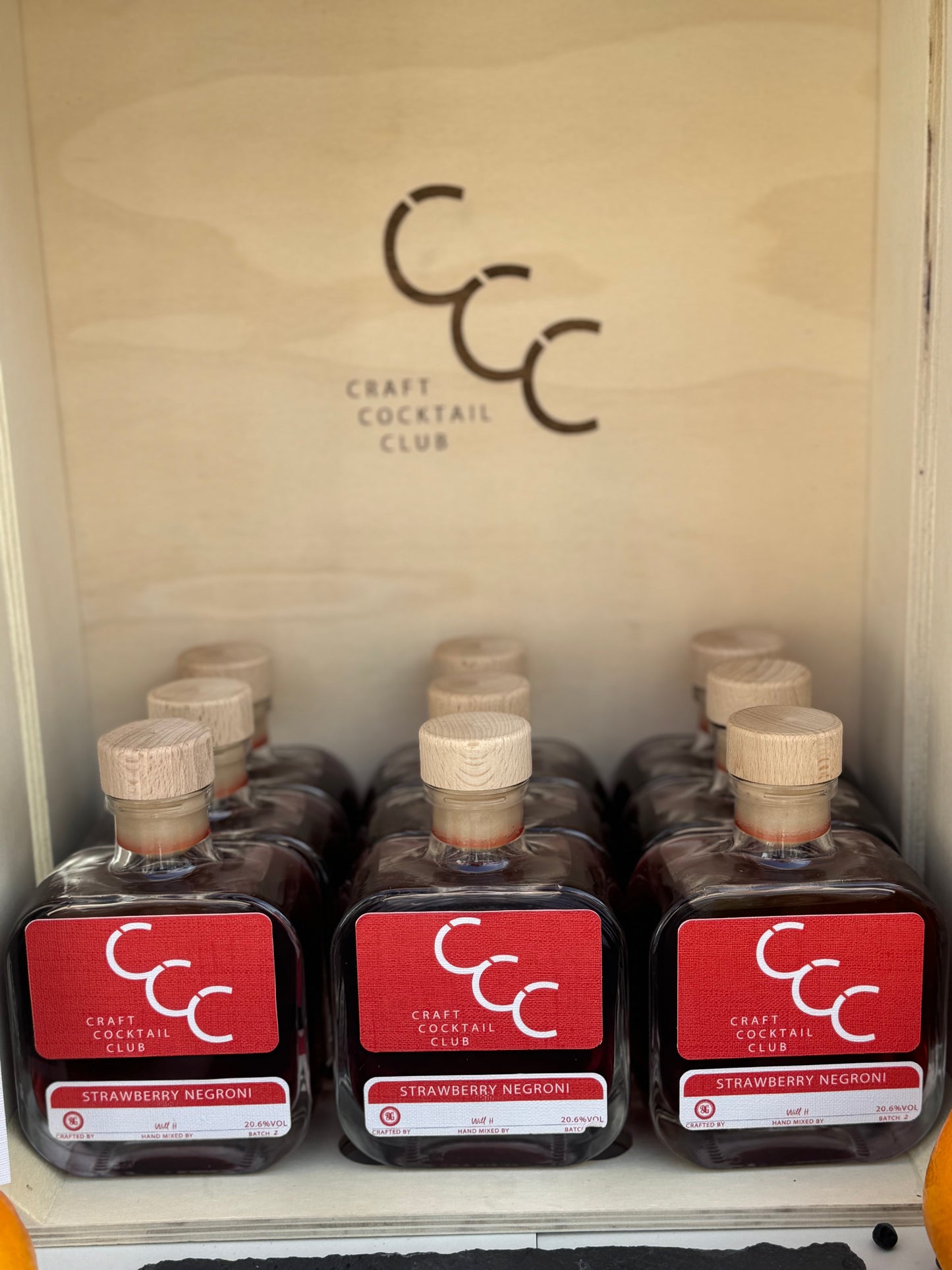 picture of 9 bottles of negroni from craft cocktail club 