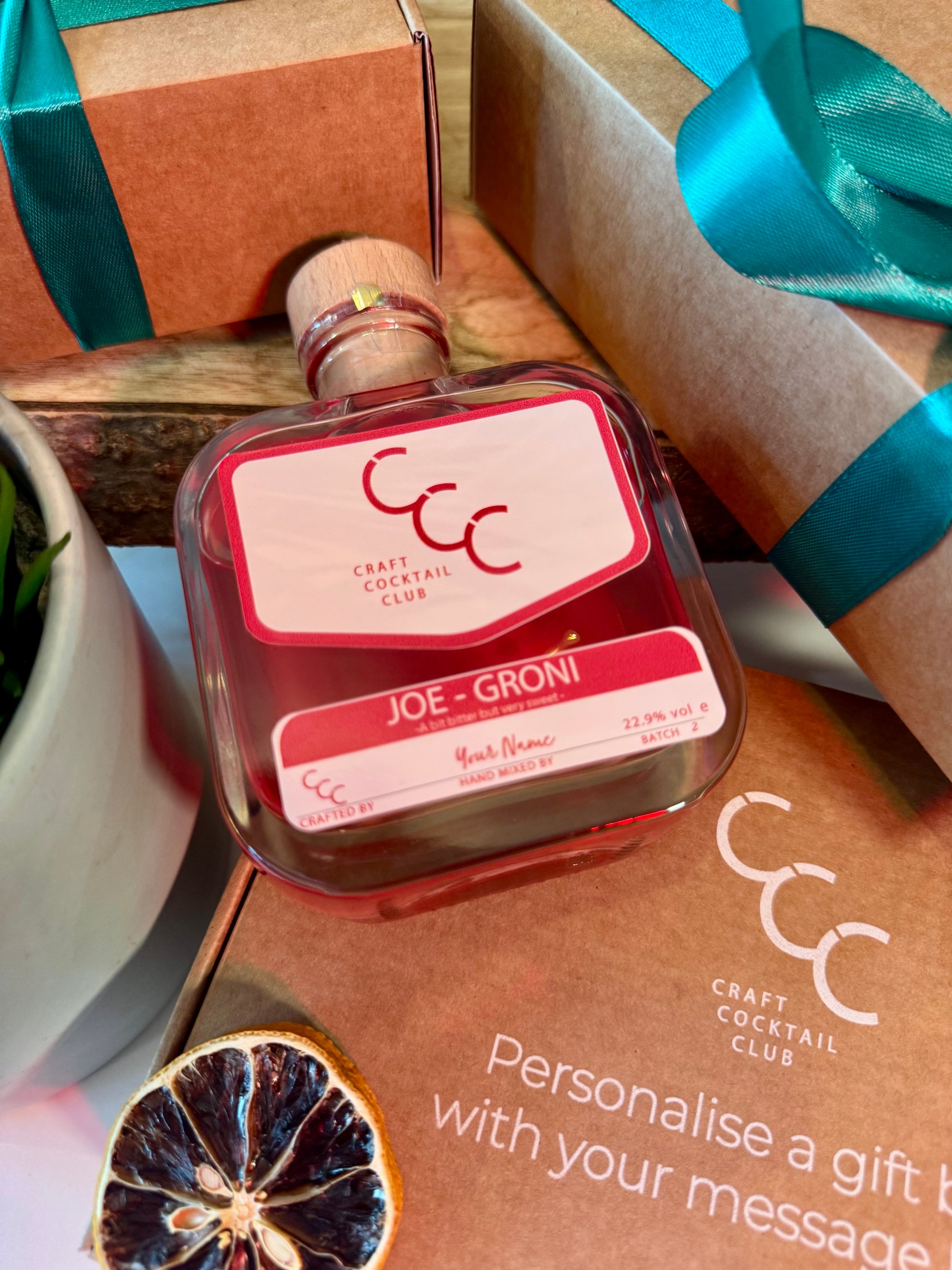 Bottle of Negroni with a personalised label reading Joe Groni cocktail with Craft Cocktail Club packaging